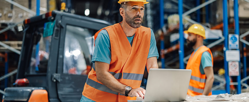 Equipment expert working on articles to teach others the world of material handling and industrial machines