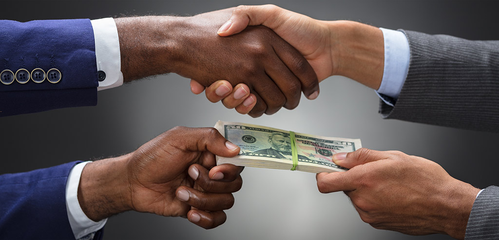 A handshake deal and money